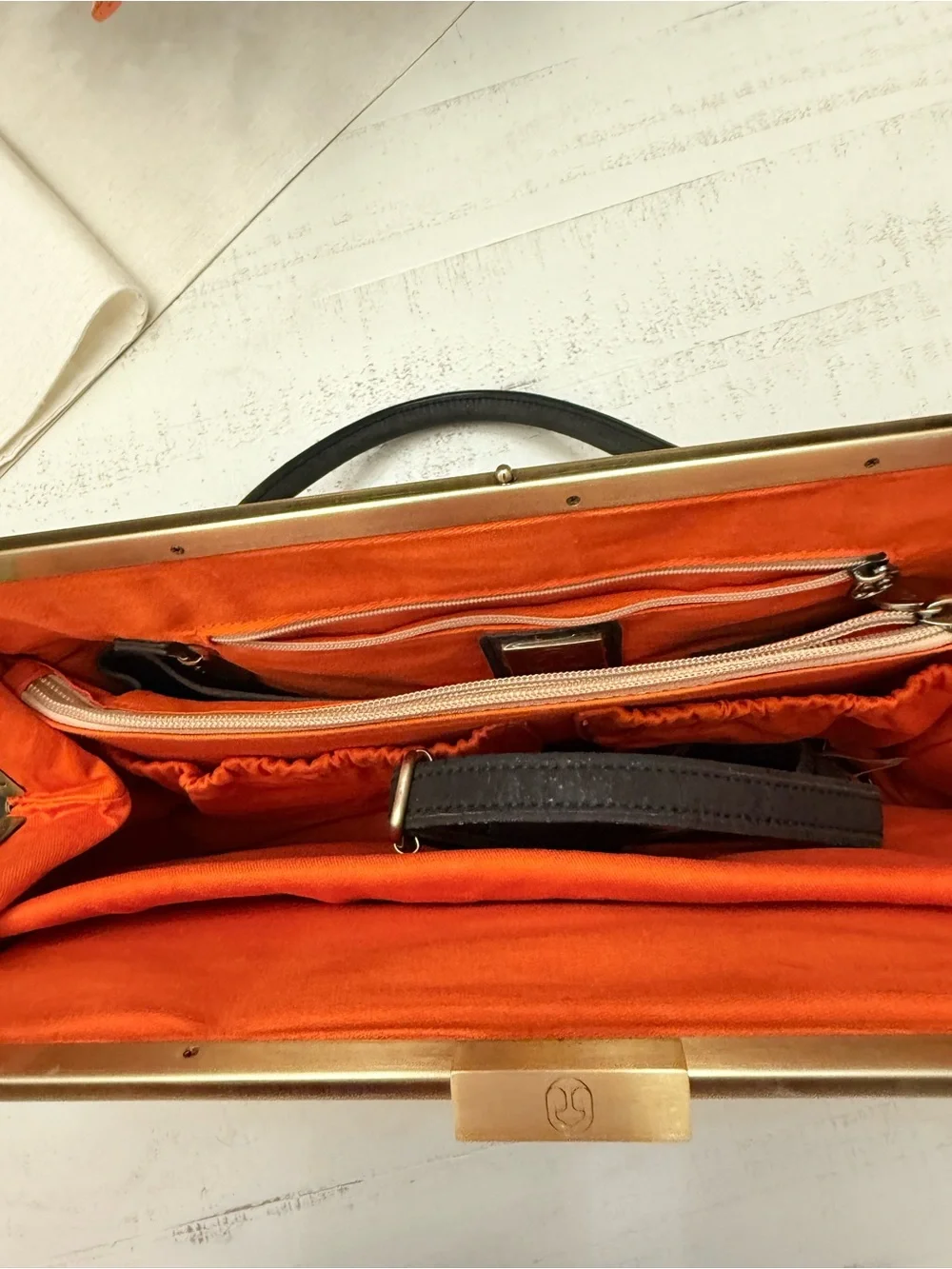 Black Satchel with Gold-Tone Hardware and Orange Interior